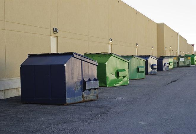 a stack of yellow construction dumpsters on a job site in Anthem